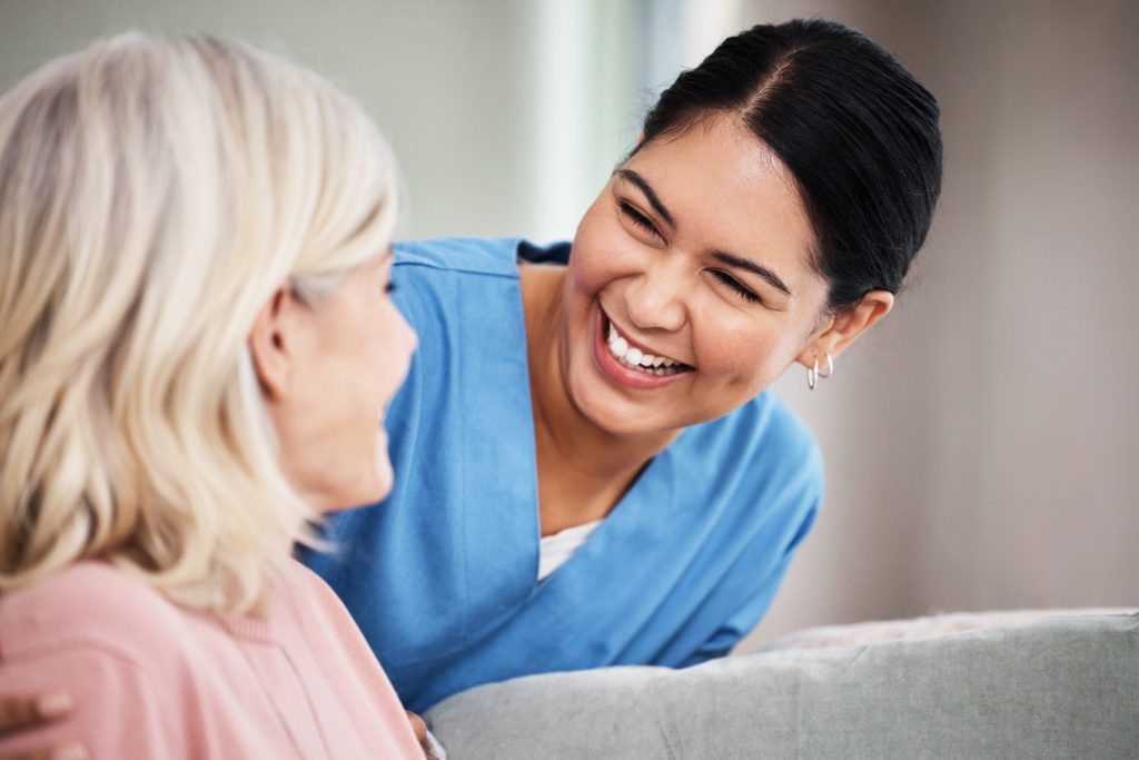 abortion nurse and patient smiling at each other